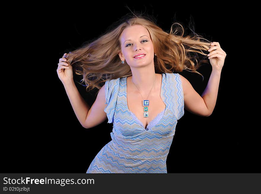 Portrait of a young girl on a black background