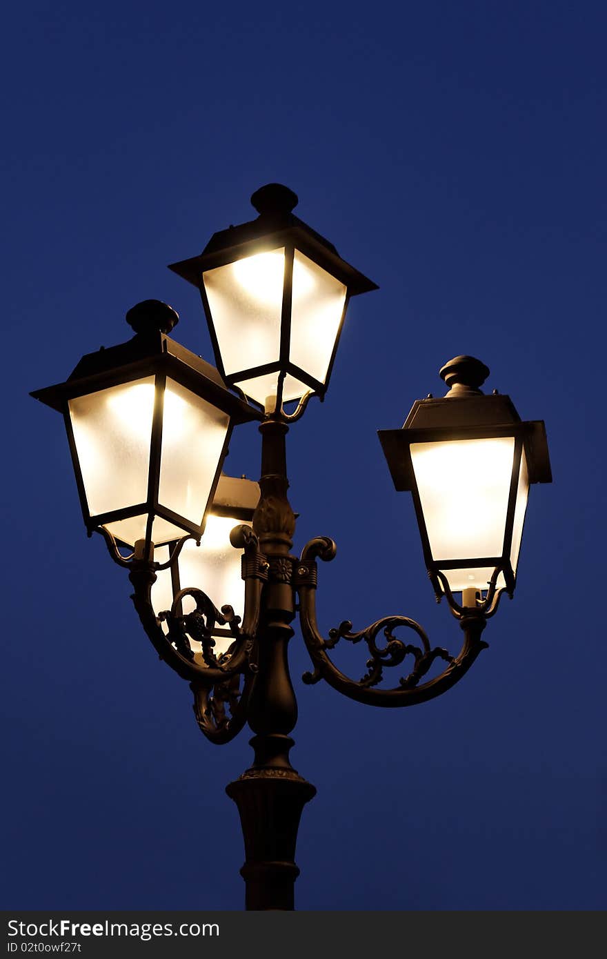 Street lights against a clear night sky. Street lights against a clear night sky