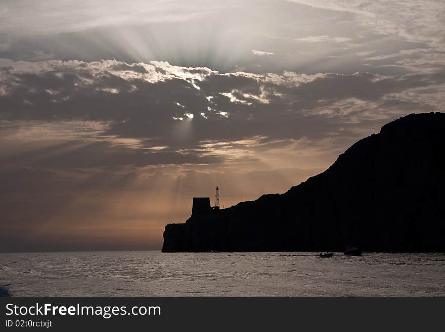 Shafts of lights from behind a cloud during an Amalfi Coast sunset. Shafts of lights from behind a cloud during an Amalfi Coast sunset