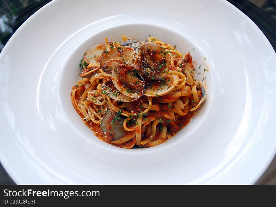 An italian meal called seafood spagetti on a plate