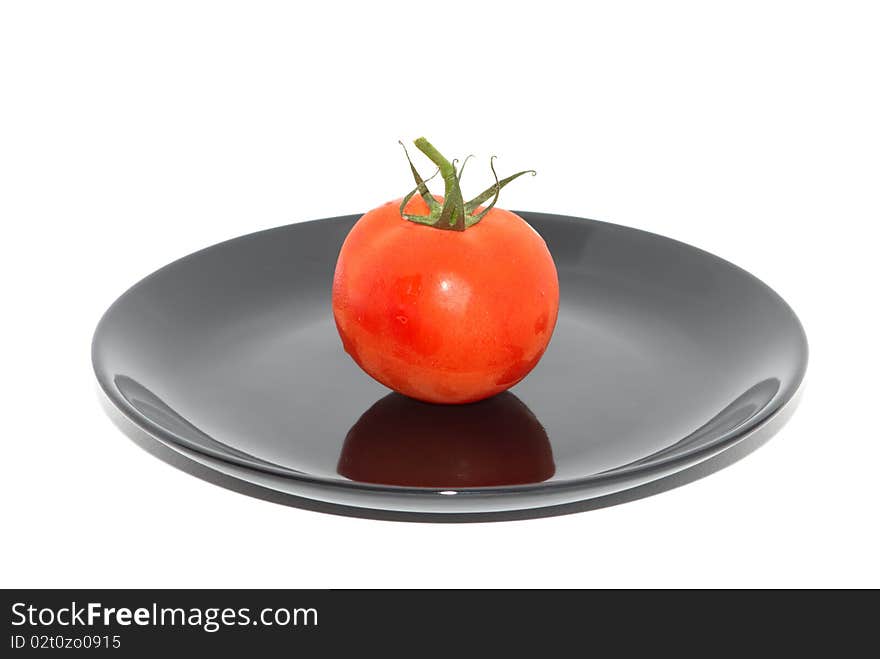 Red tomato on the white background. Red tomato on the white background