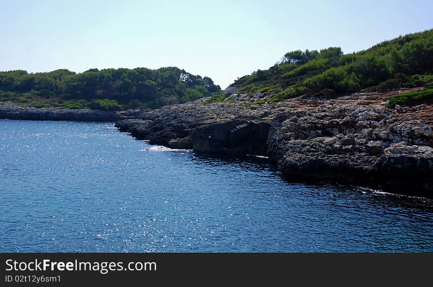 View of an idilic beach and coast in southeast of Mallorca (Spain). View of an idilic beach and coast in southeast of Mallorca (Spain)