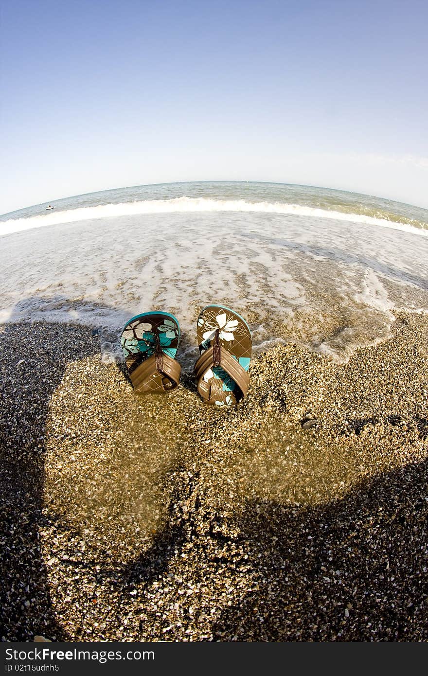 Flip flops on the beach fisheye look