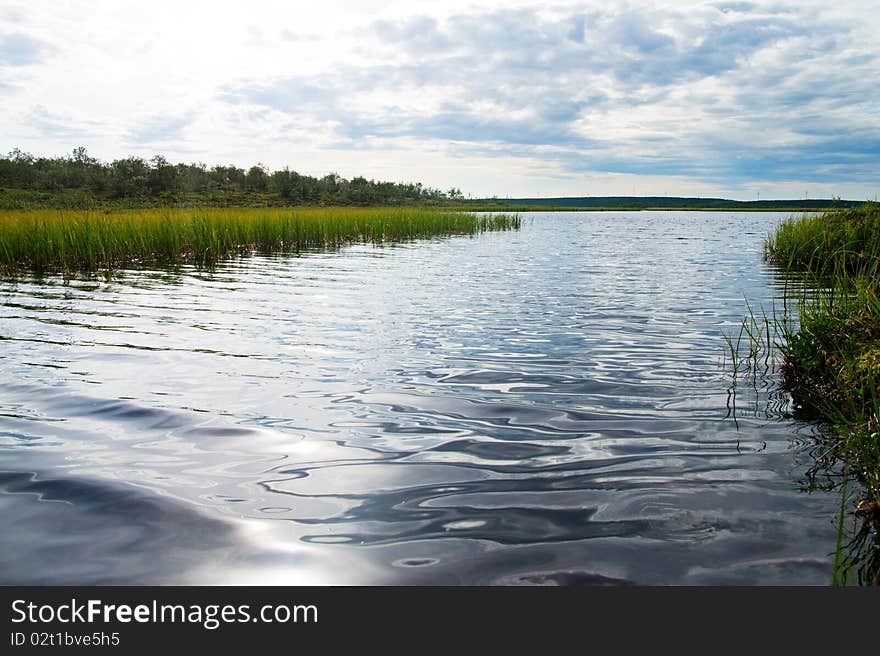 North nature of Kola Peninsula. One of thousand lakes.