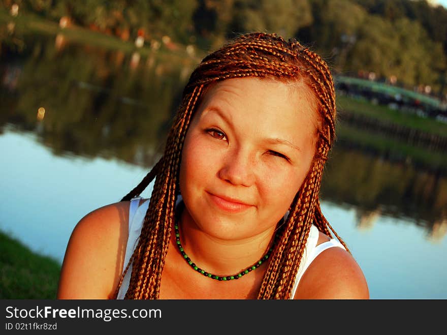 Pretty asian girl with braids looks skeptically. Pretty asian girl with braids looks skeptically