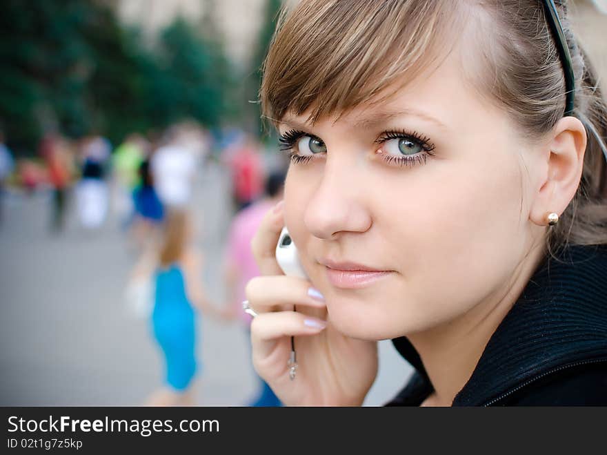 Young girl talking on the phone