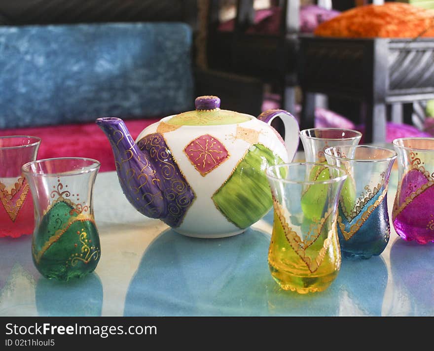 Moroccan teapot and some painted cups. Moroccan teapot and some painted cups