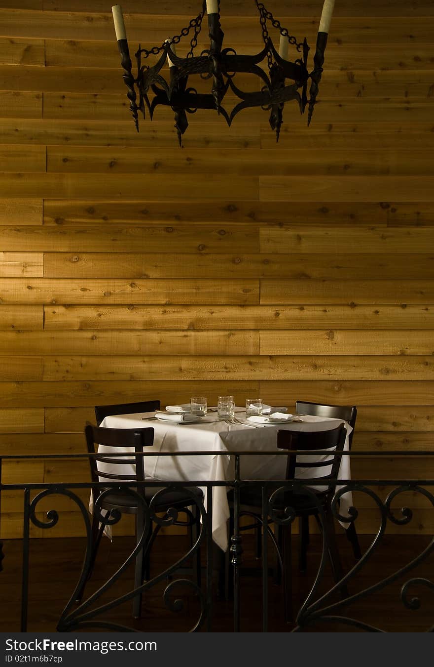 Single table against a wooden wall. Single table against a wooden wall