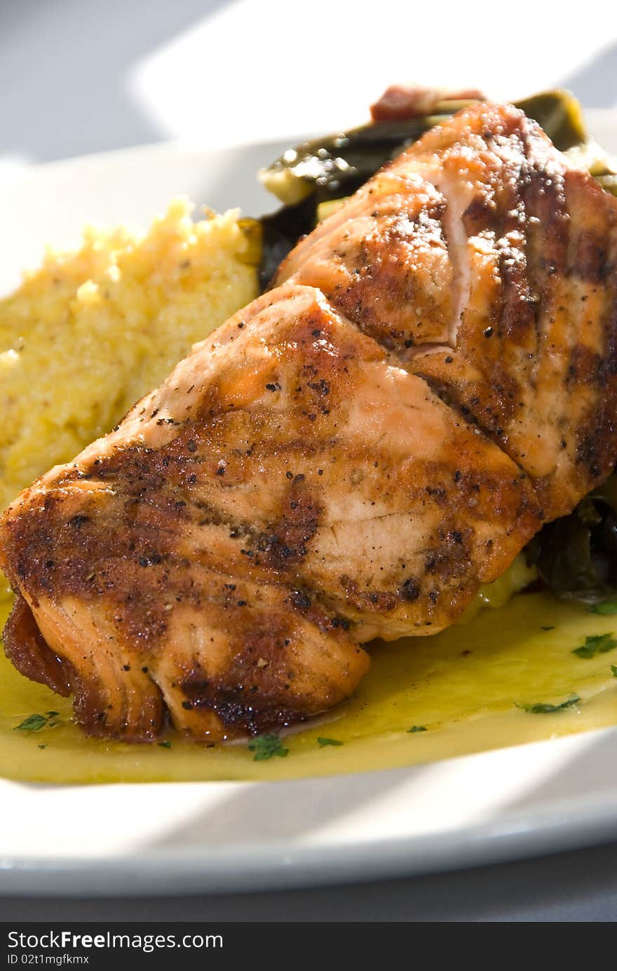 Grilled salmon with turnip greens and grits