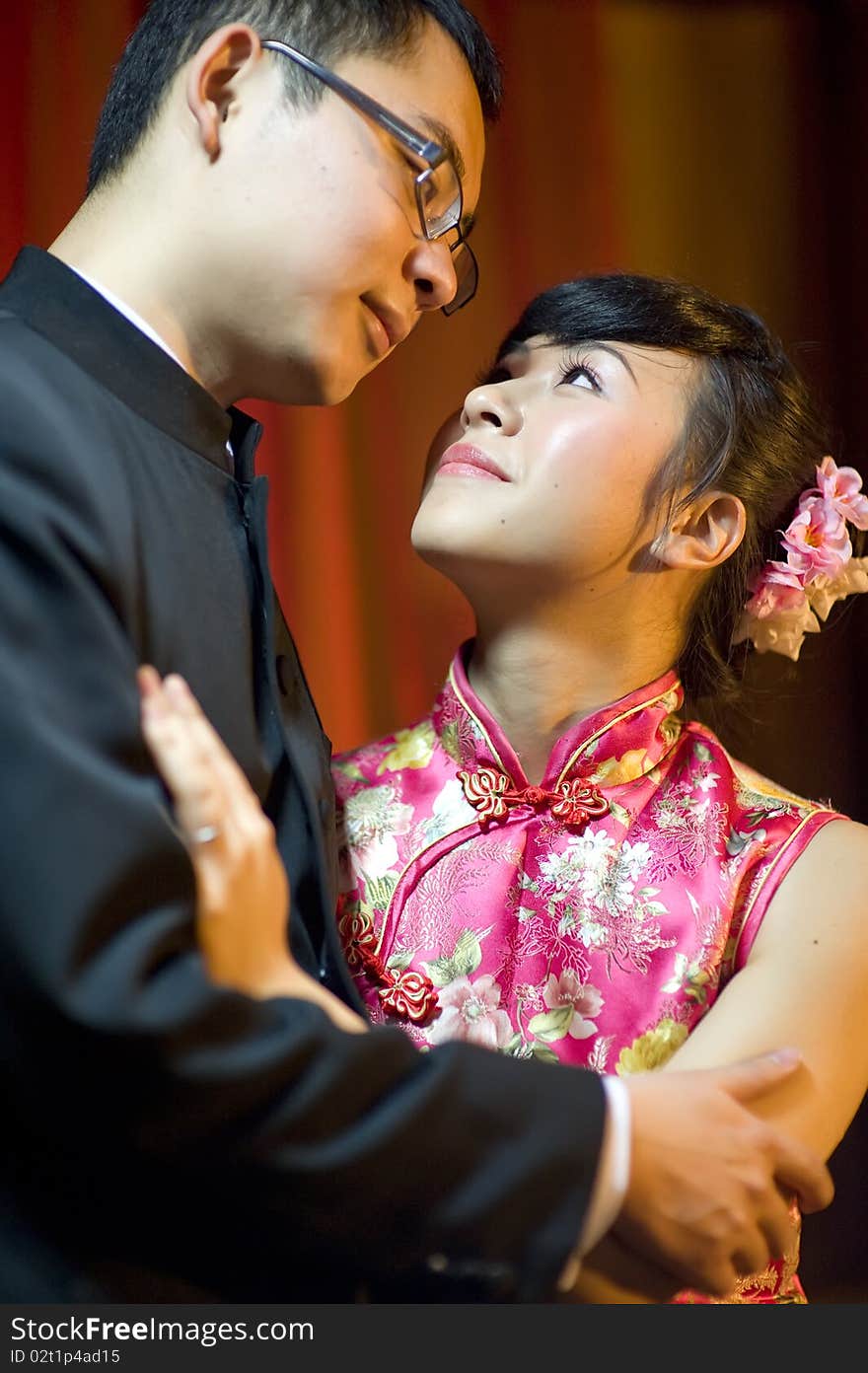 An affectionate young couple embracing before their wedding day. An affectionate young couple embracing before their wedding day