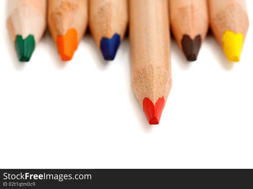 Macro of colored pencils on a white background