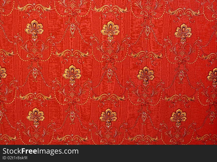 Red textile background with flowers on it