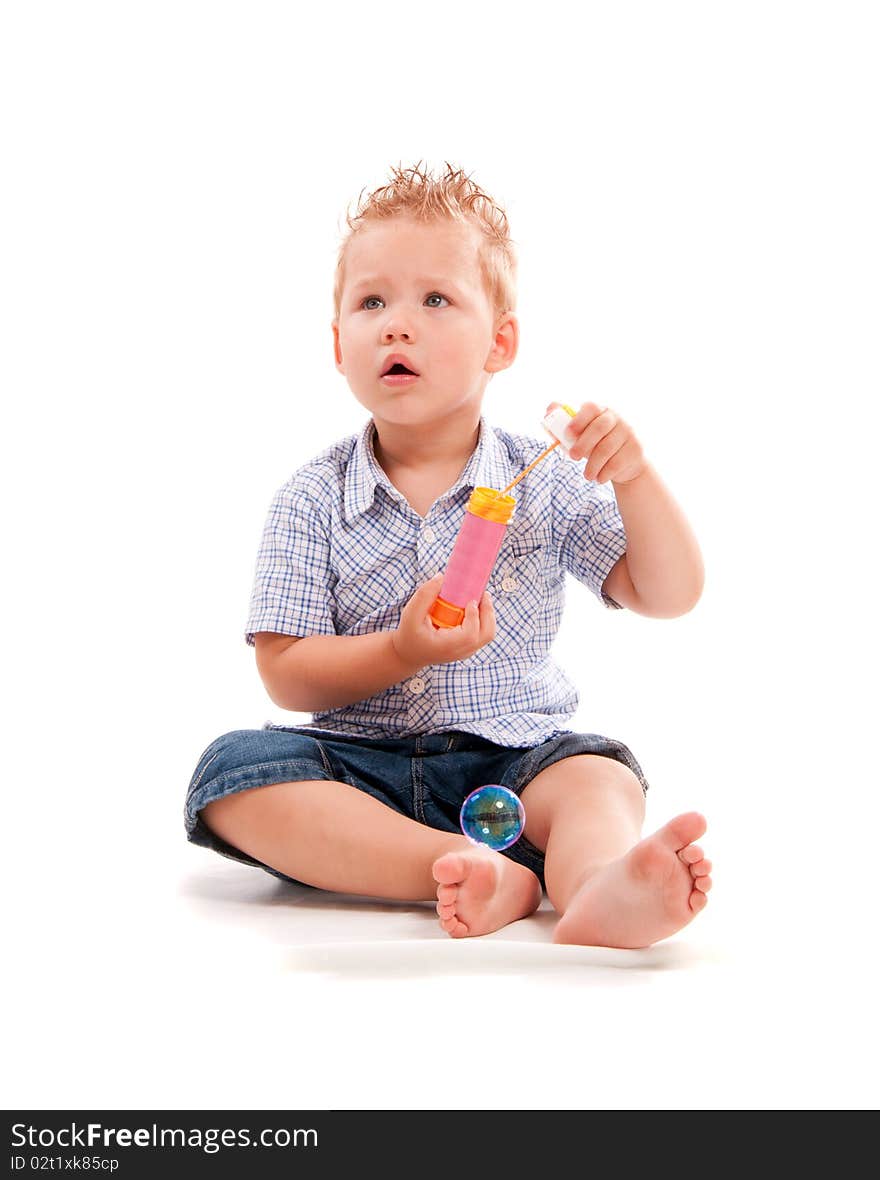 Baby playing with soap bubbles