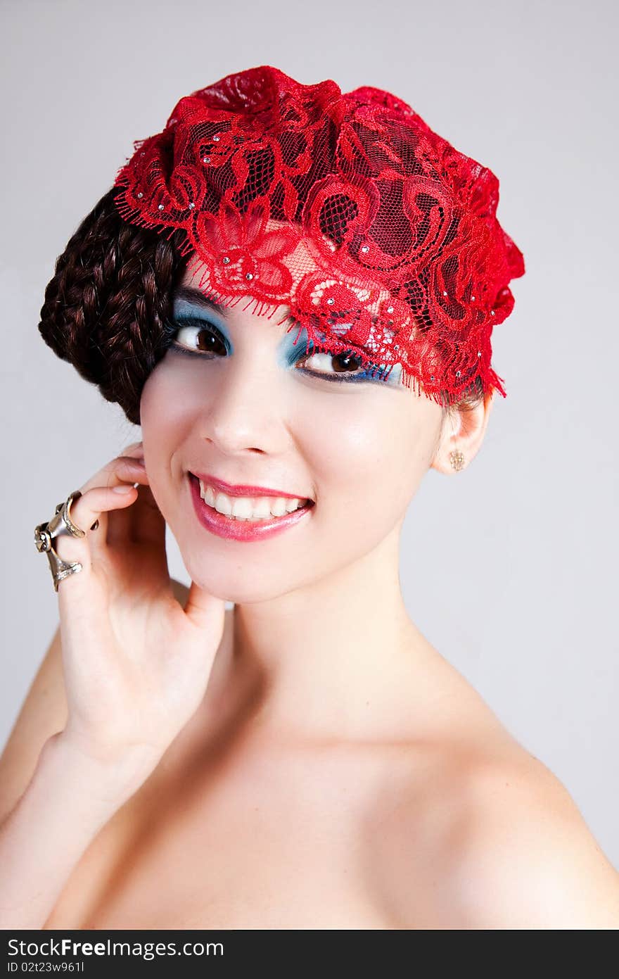 Beautiful Young Woman with a Lace Headpiece