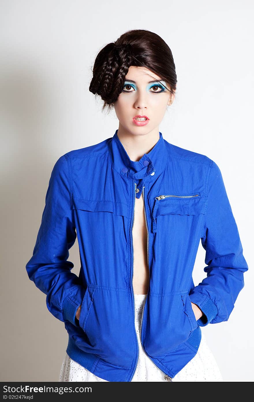 High Fashion Young Woman in a Blue Jacket