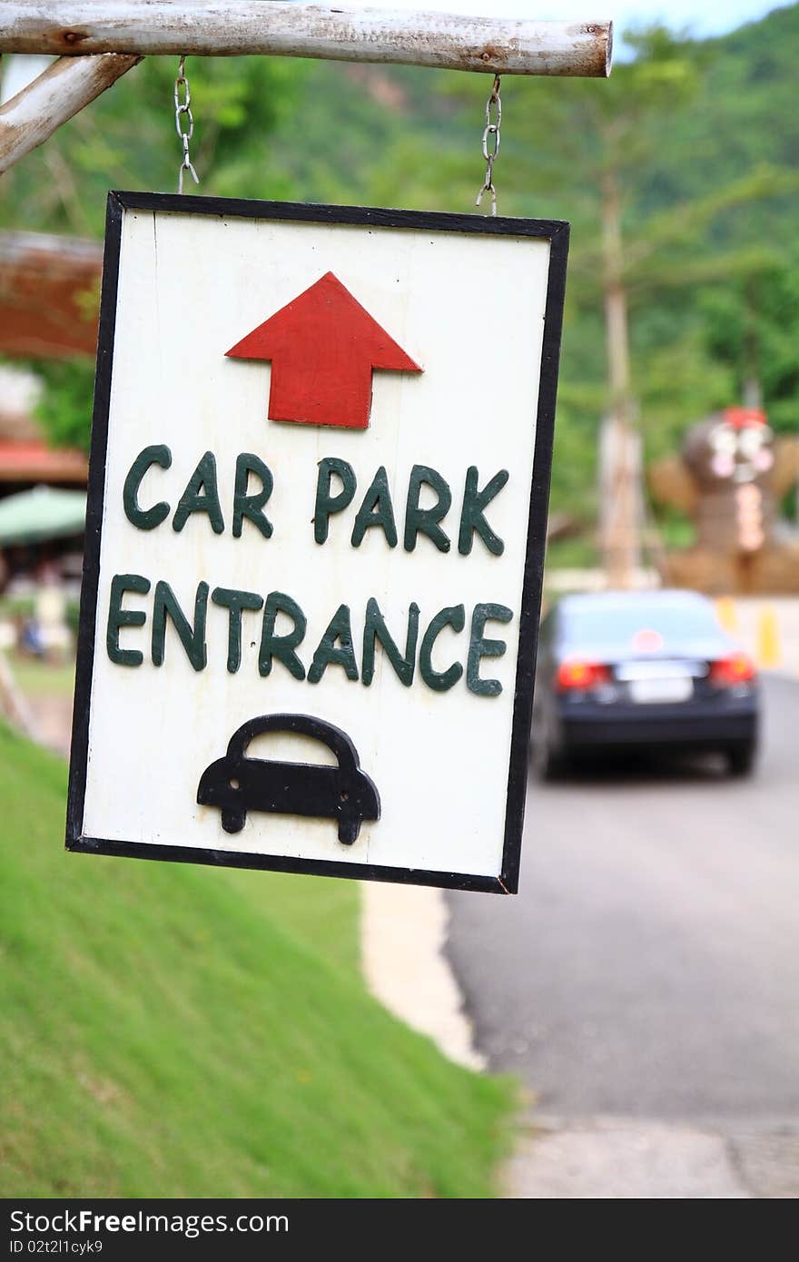 Wood sign car park entrance