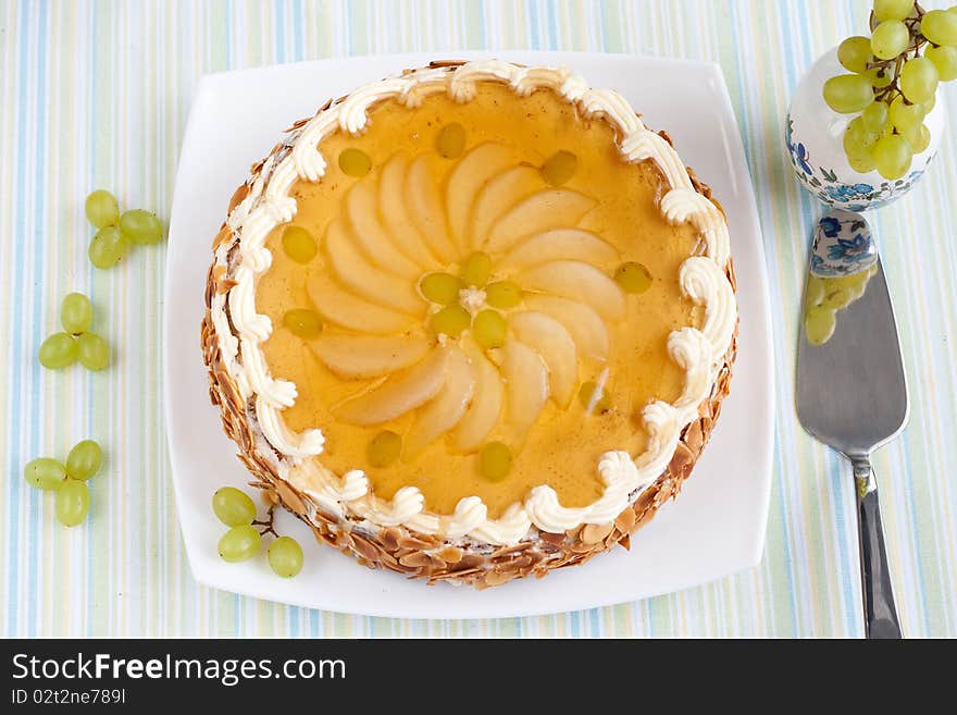 Biscuit Cake with fresh fruits topping under jelly