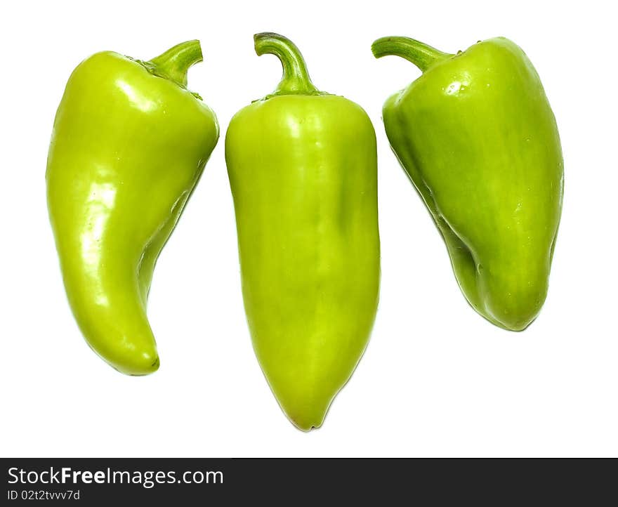 Three green peppers isolated on white background