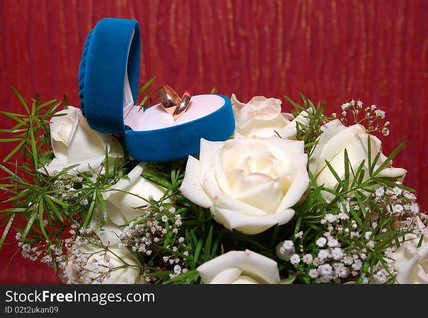 Wedding Rings In Blue Box And Rose