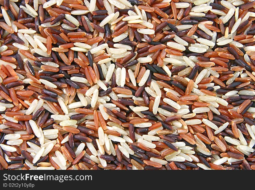 Closeup of Thai Whit Red Jasmine and Fragment magenta rice, Trois Amis Organic, Background texture surface pattern. Closeup of Thai Whit Red Jasmine and Fragment magenta rice, Trois Amis Organic, Background texture surface pattern.