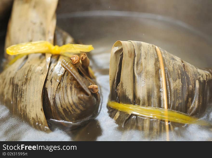 Cooked Chinese traditional meat dumplings in cooking pot. For food and beverage, customs and traditions, and local and creative cuisine concepts. Cooked Chinese traditional meat dumplings in cooking pot. For food and beverage, customs and traditions, and local and creative cuisine concepts.