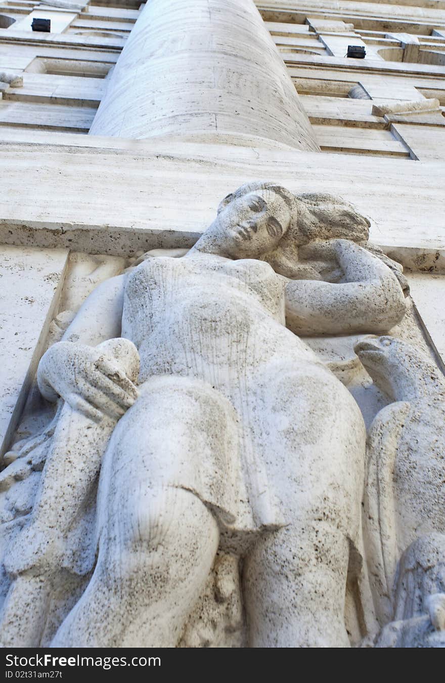 Woman statue of the exchange building of Milan