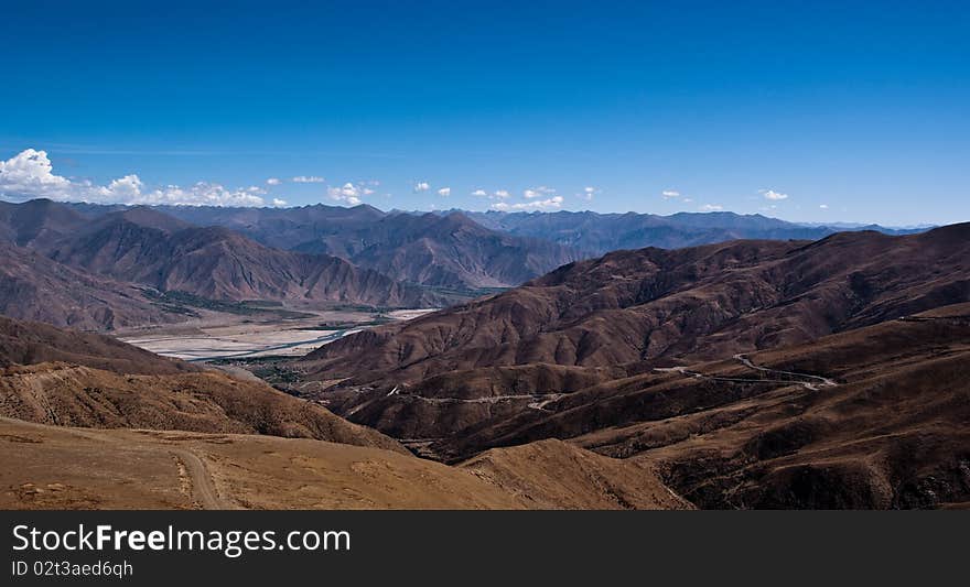 Yellowish mountain road view in tibet of China