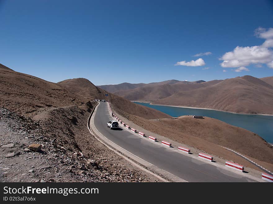 Blue lake with surrounding mountains in great tibet area. Blue lake with surrounding mountains in great tibet area