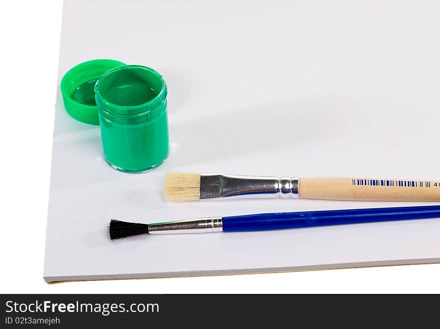 Gouache paint cans and brush with blank paper isolated on white background. Gouache paint cans and brush with blank paper isolated on white background