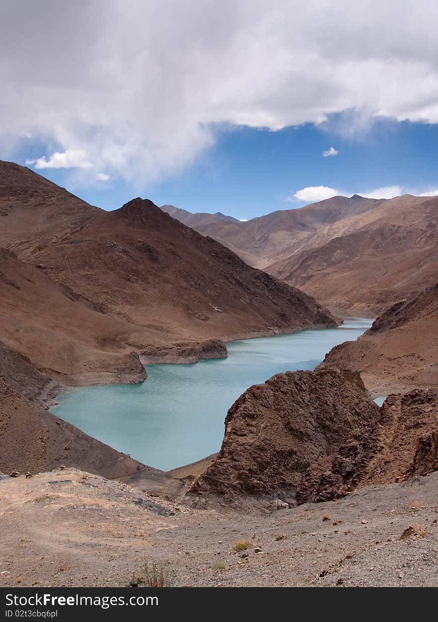 Blue lake with surrounding mountains in great tibet area. Blue lake with surrounding mountains in great tibet area