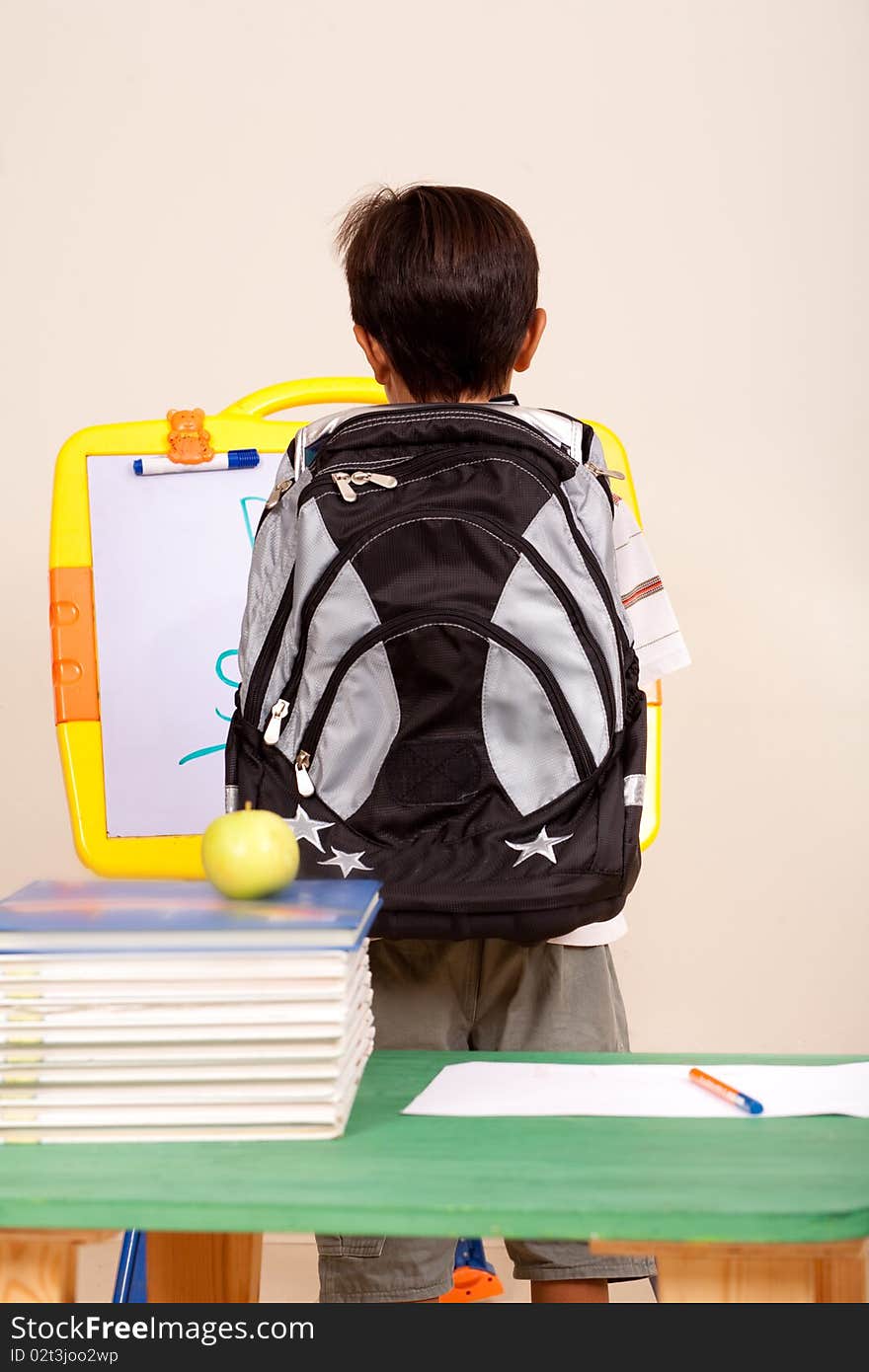 Rear view of a young student with back pack. Rear view of a young student with back pack