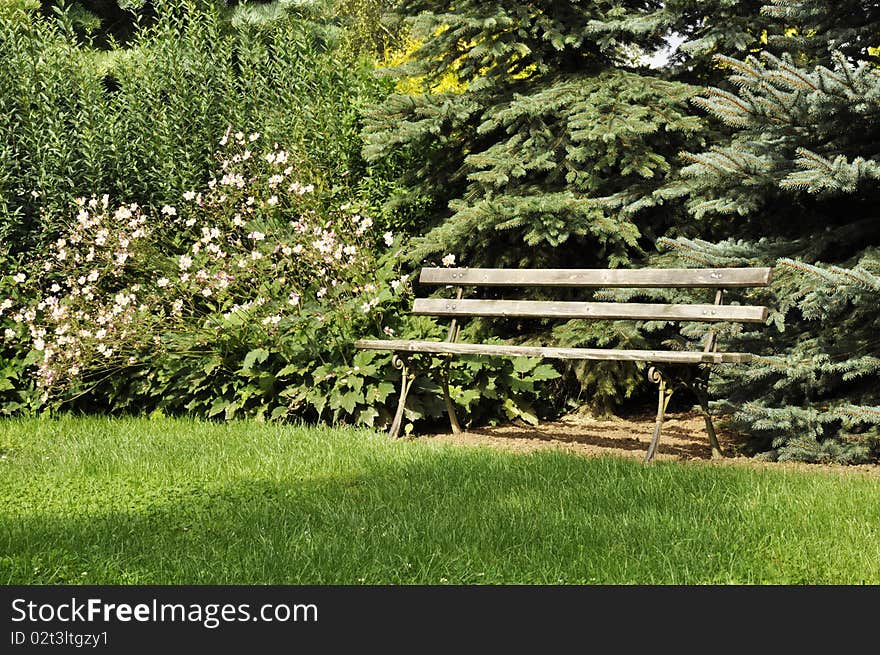 Park bench encourages to relax. Park bench encourages to relax