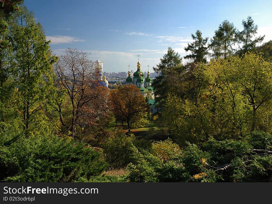 Autumnal park with orthodox church