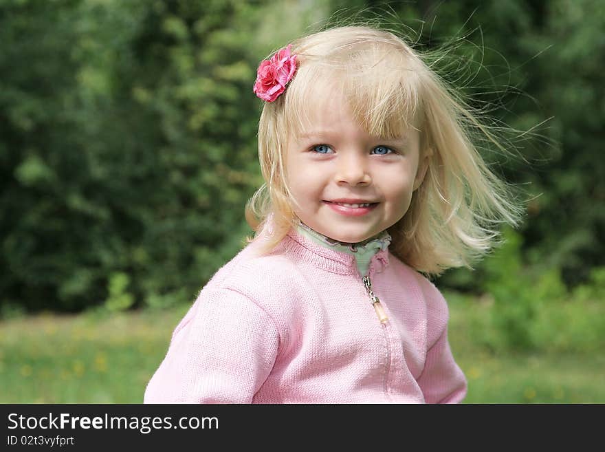 Beautiful girl with flower in her hair