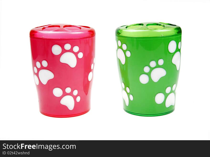 Two cute cups with pet footprints on white. Two cute cups with pet footprints on white.