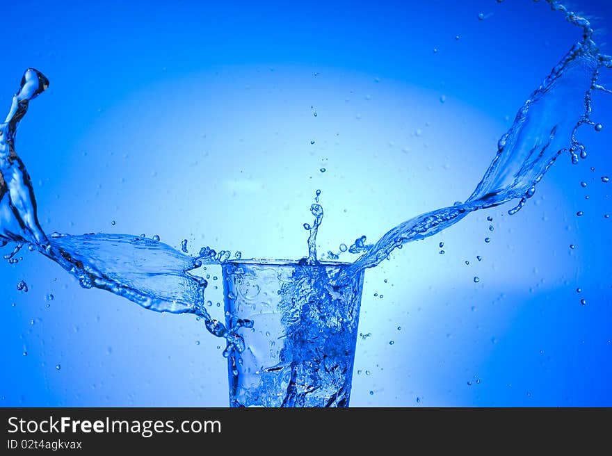 Fresh  spray water on blue background