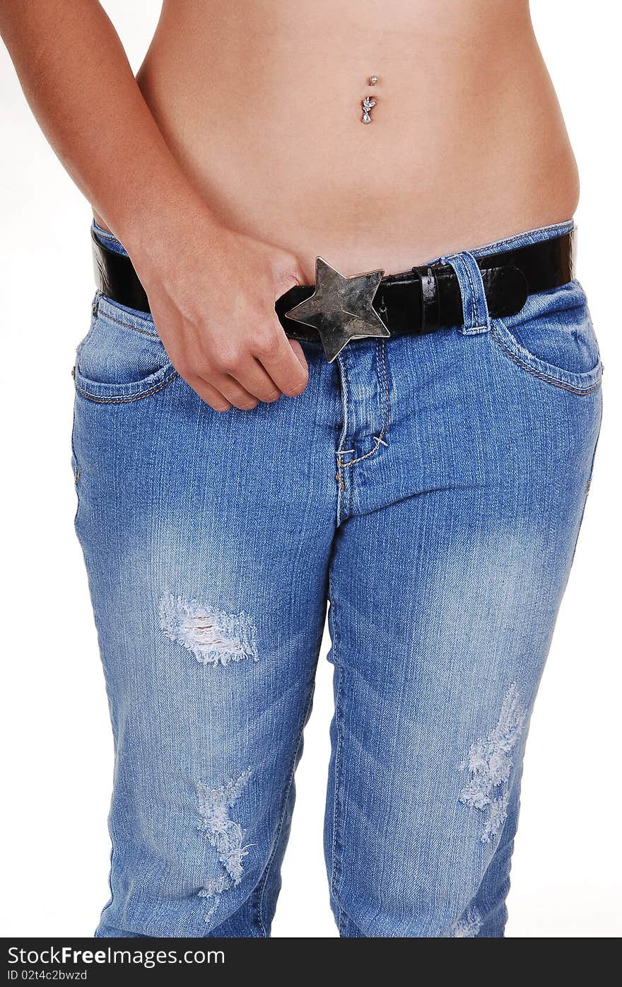 A young woman standing in the studio in jeans and topless, shooing her nice
stomach and belly button and the star on her belt, for white background. A young woman standing in the studio in jeans and topless, shooing her nice
stomach and belly button and the star on her belt, for white background.