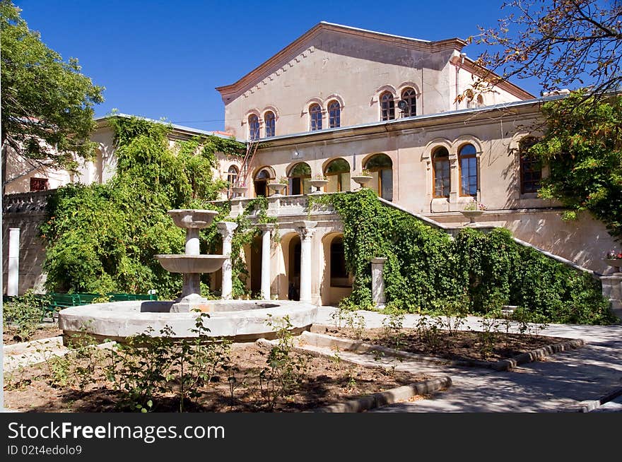 Medieval overgrown house with fountain. Medieval overgrown house with fountain