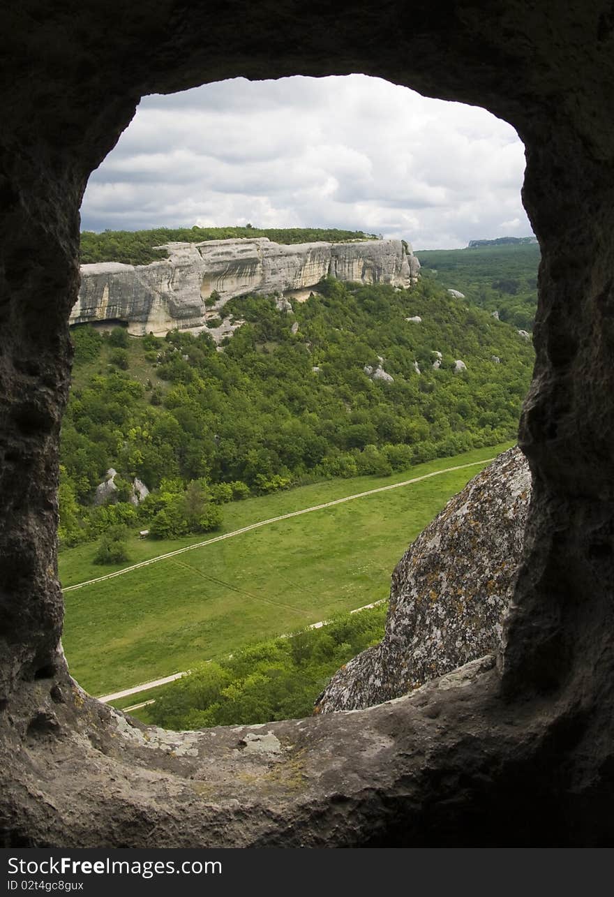 Mountain landscape through the rock  hole. Mountain landscape through the rock  hole