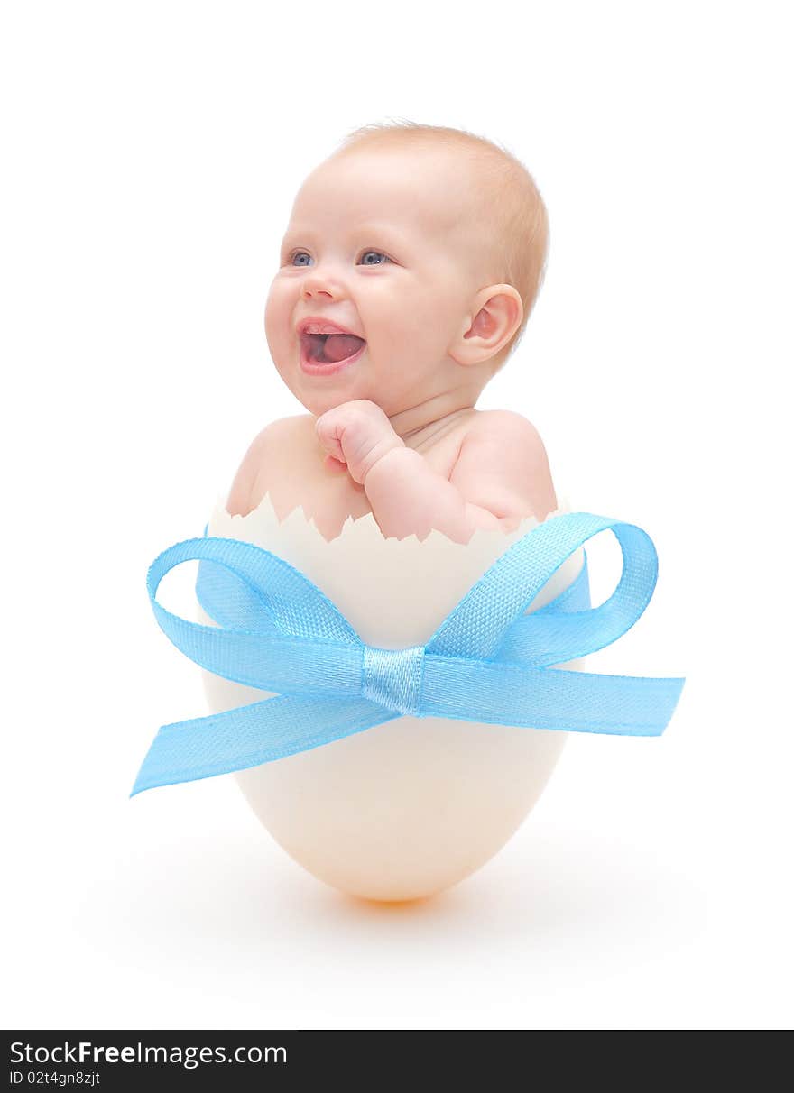 Baby boy in egg on white background