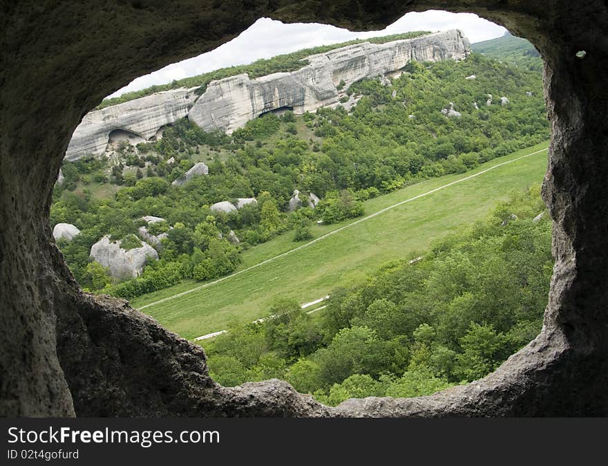 Mountain landscape through the rock  hole. Mountain landscape through the rock  hole