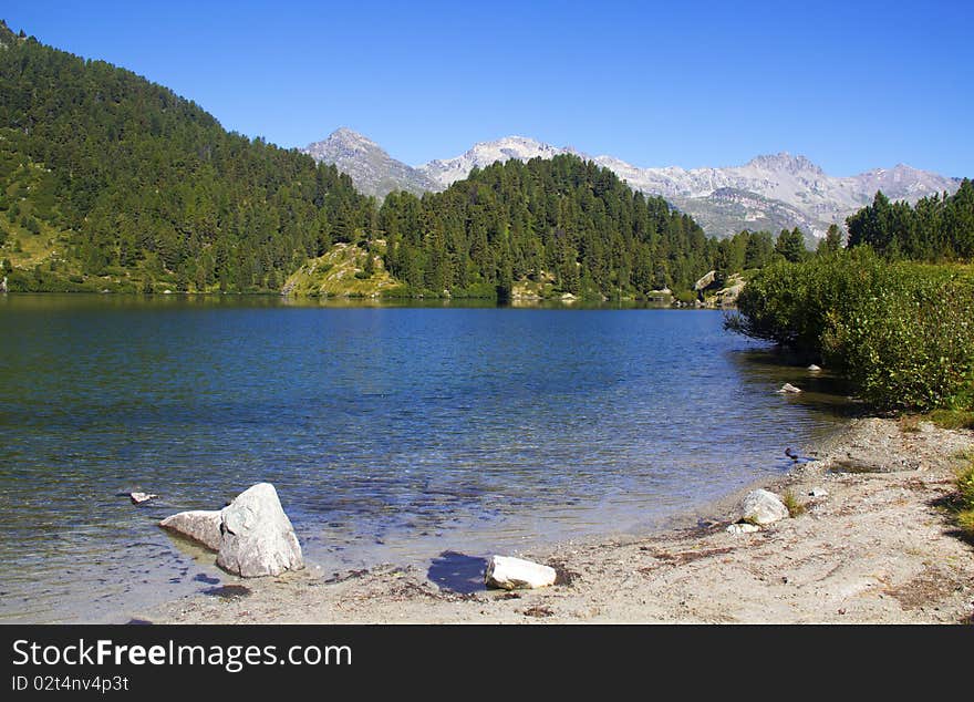 Alpine lake Cavloc Engadine in Switzerland