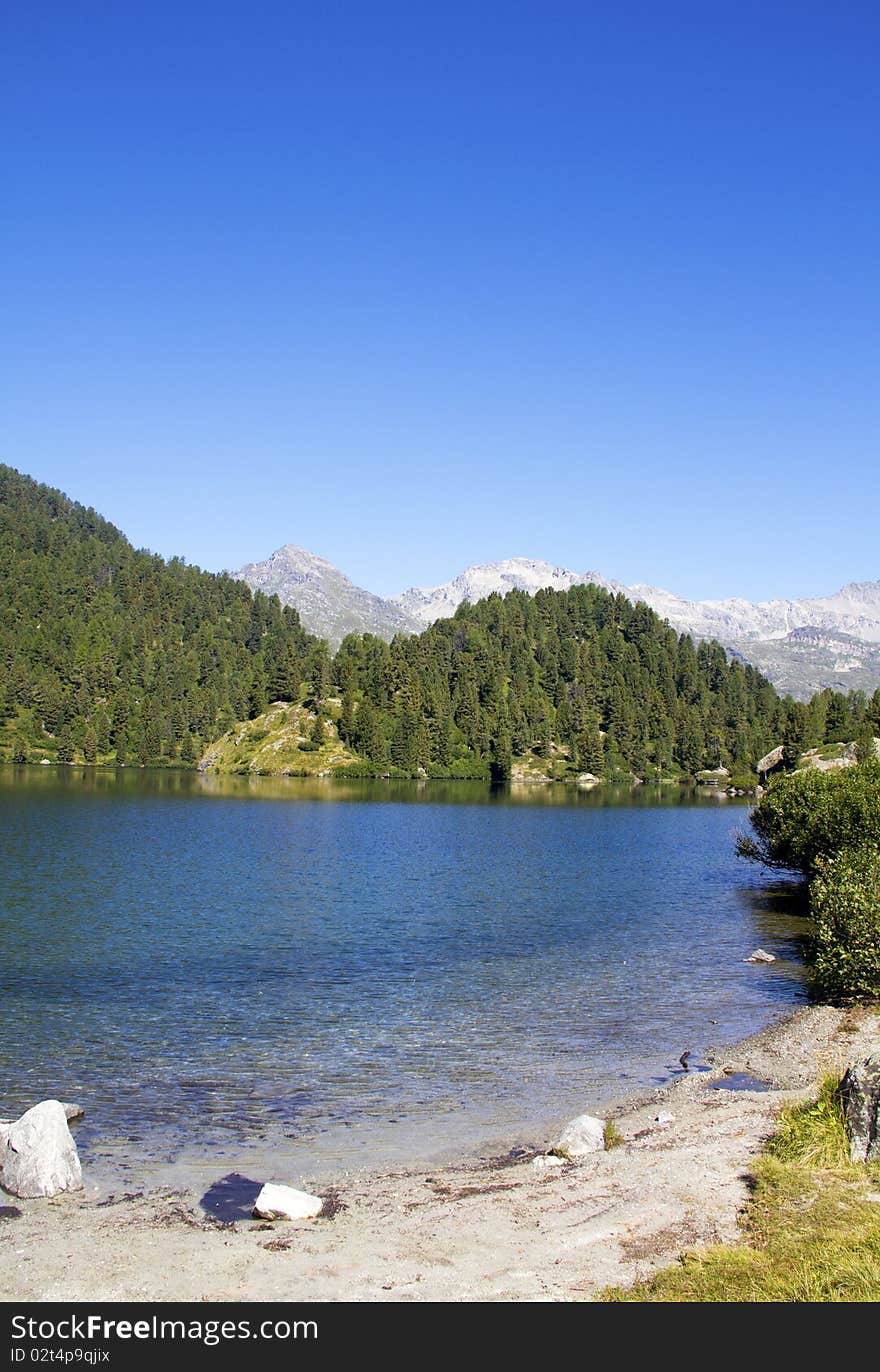 Alpine lake Cavloc Engadine in Switzerland