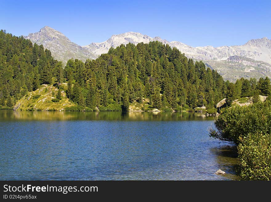 Alpine lake Cavloc Engadine in Switzerland