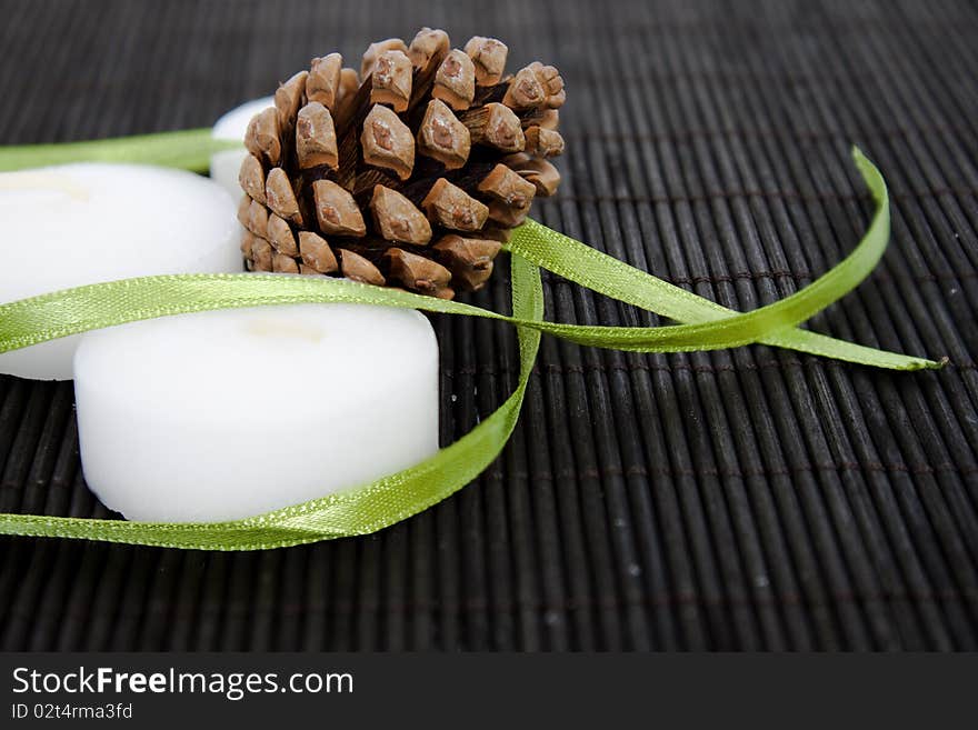 White candles on black background with cone. White candles on black background with cone