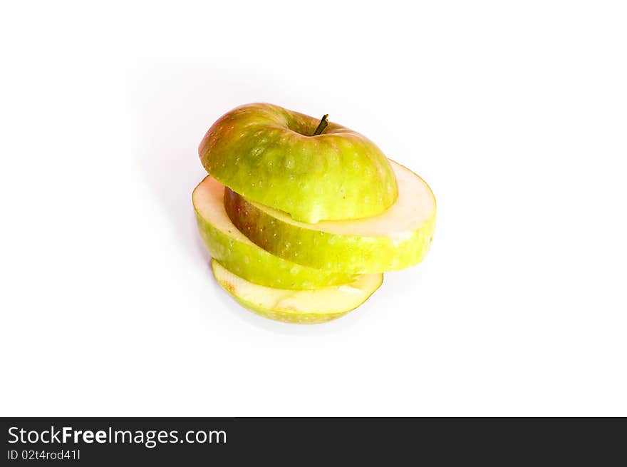 Fresh green apple slices isolated on white