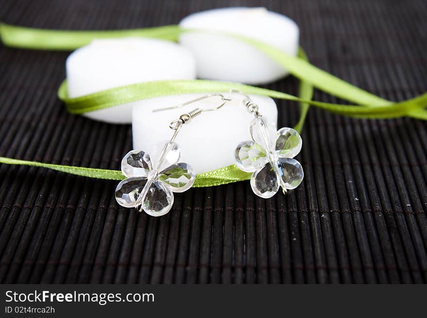 White candles and earrings