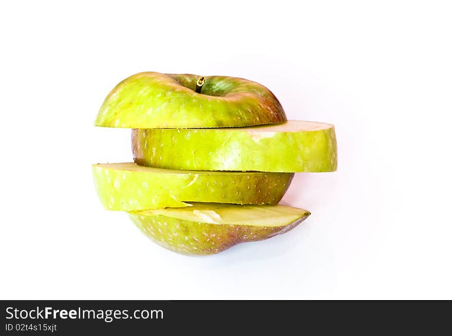 Fresh green apple slices isolated on white