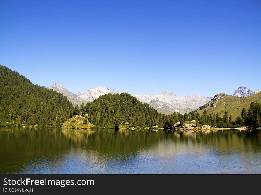 Alpine lake Cavloc Engadine in Switzerland