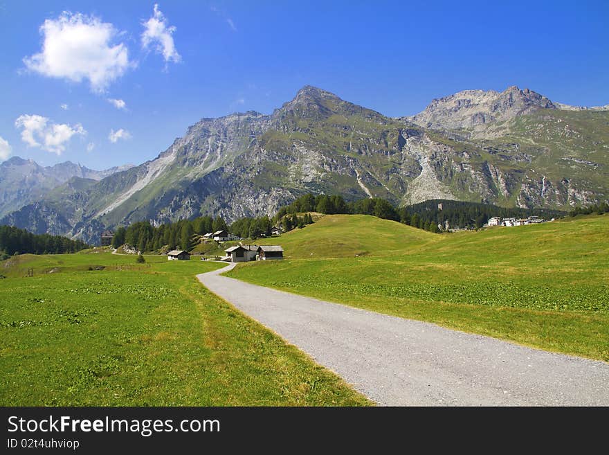 Swiss mountains and meadows with huts typical. Swiss mountains and meadows with huts typical